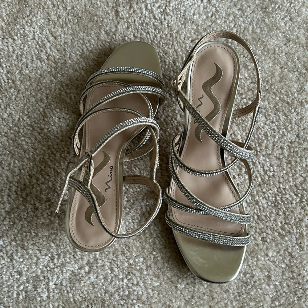 Formal, gold sandal with rinestones. 1 1/2 inch heel, worn one time